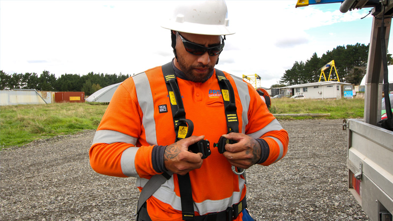 PRSL employee wearing safety harness